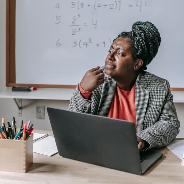 Dr Aditi the OT - A teacher looking thoughtful, wondering if a student's problems are educationally Relevant to School OT.
